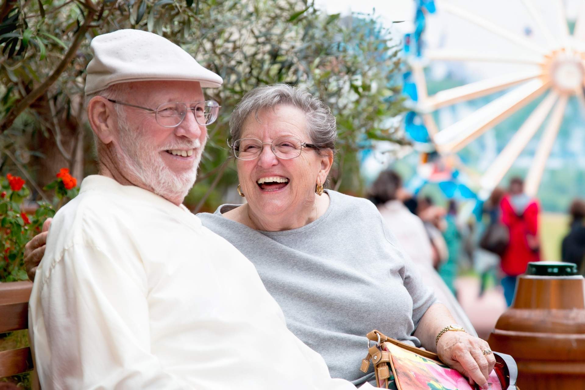 A senior couple smiling at the fair.